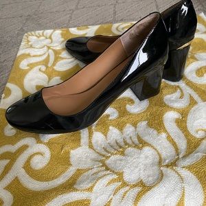 Calvin Klein patent leather block heel pump.